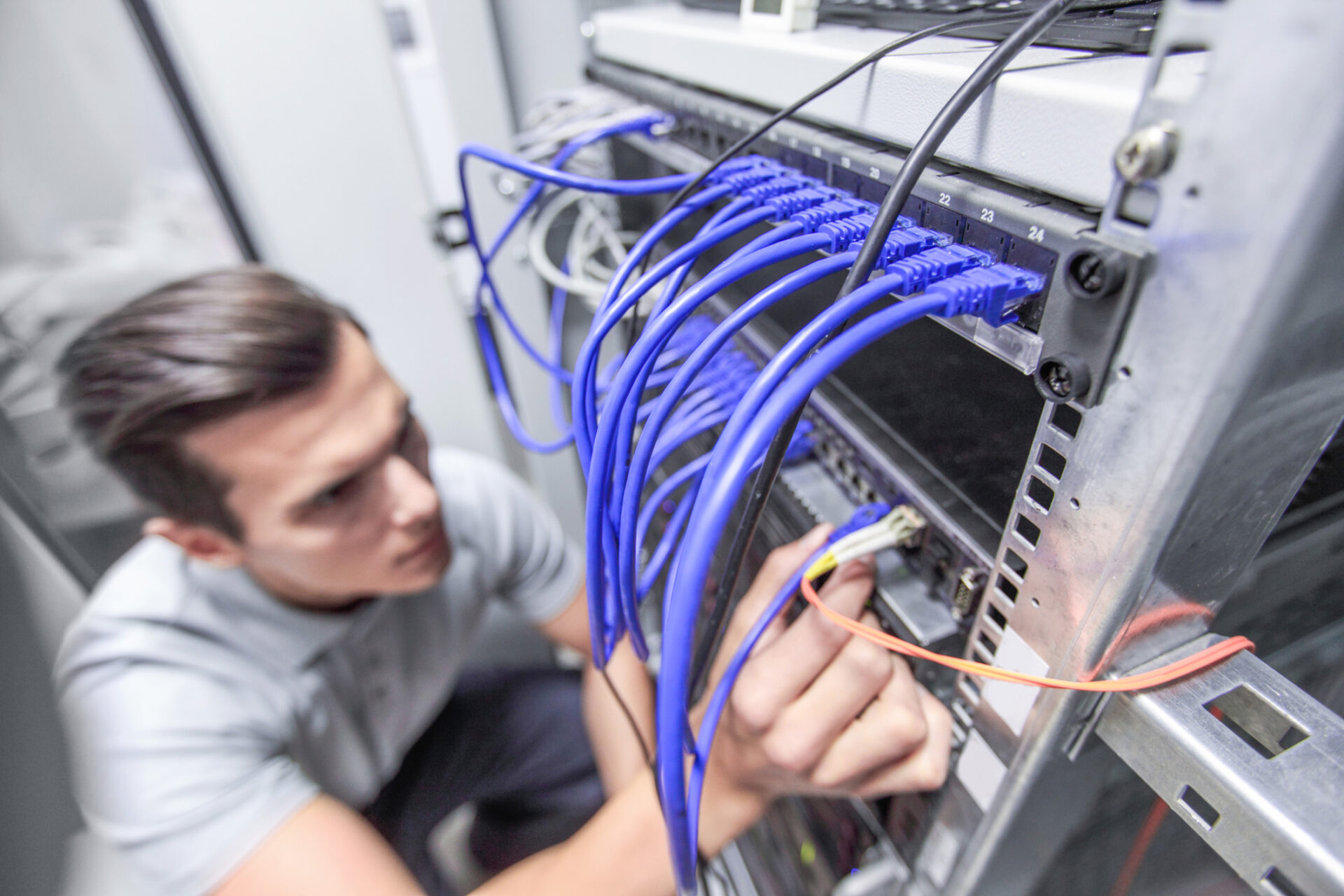 Man working in network server room